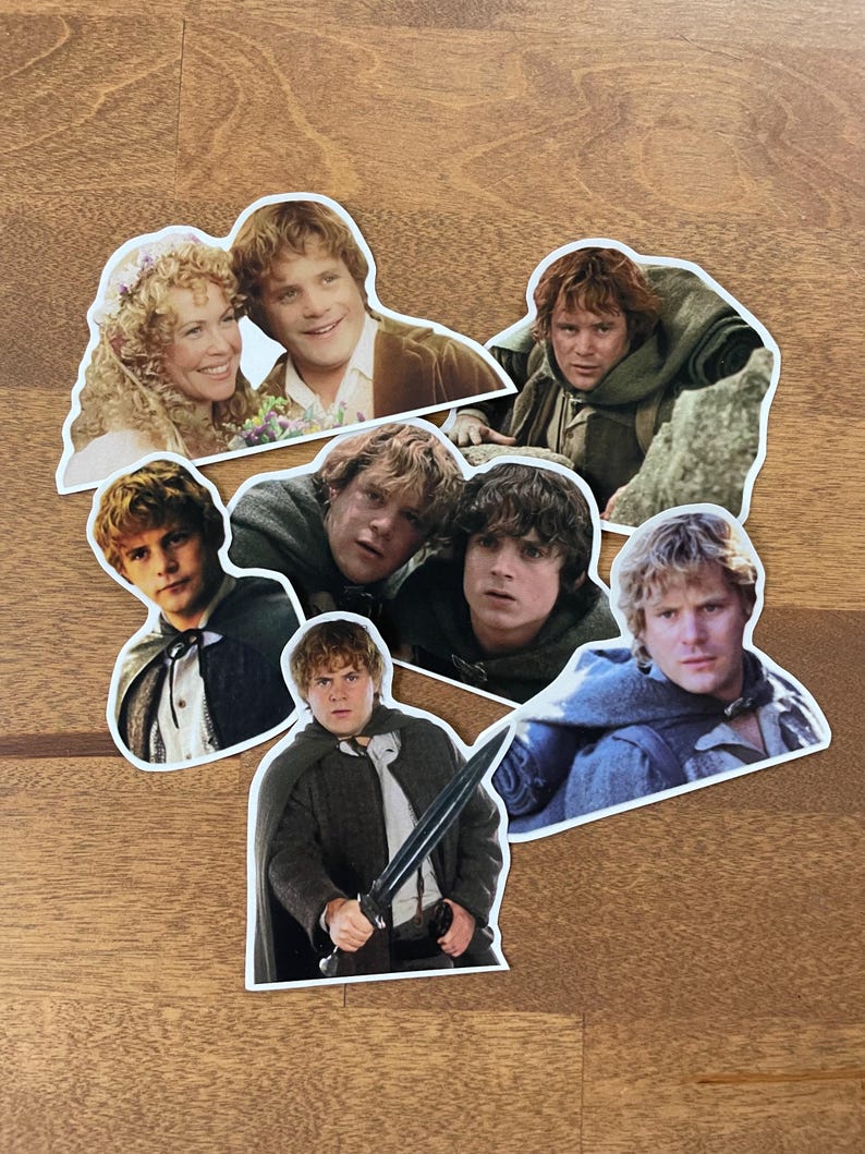 May include: A set of eight stickers featuring different images of a character from the Lord of the Rings movie franchise. The stickers are printed on white paper and have a rounded shape.