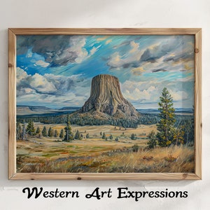 May include: A framed painting depicting a landscape with a large rock formation, a blue sky with white clouds, and green trees. The rock formation is called "Devils Tower" and is located in Wyoming, USA. The painting is titled "Western Art Expressions".