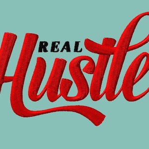 May include: Red embroidered text that reads "REAL HUSTLE" on a light blue background.