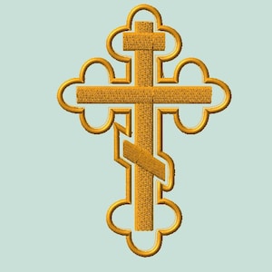 May include: A gold-colored Orthodox cross with a textured appearance. The cross features a top bar, a central vertical bar, and a slanted footrest. The design includes decorative, rounded edges.