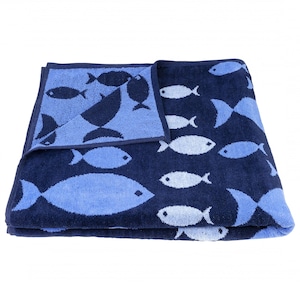 May include: A blue beach towel with a white fish pattern. The towel is folded in half and the pattern is visible on both sides.