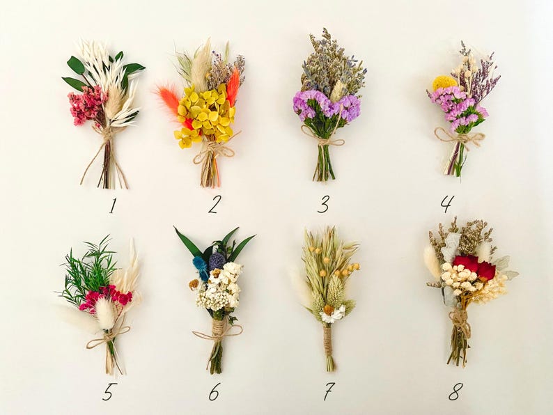 May include: Eight small bouquets of dried flowers, each tied with twine and numbered 1 through 8. The bouquets feature a variety of colors and textures, including pink, purple, yellow, white, and red.