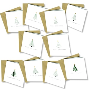 May include: A collection of Christmas cards with various green Christmas tree designs, each topped with a gold star. The cards are white with the words "MERRY CHRISTMAS" printed in black. Each card is paired with a brown envelope.
