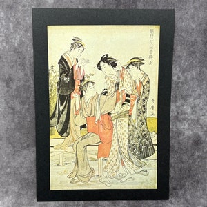 Impressão de uma pintura do famoso artista japonês Kitagawa Utamuro, montada em cartão preto A4