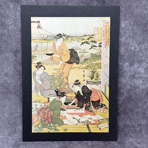 Impression d'une peinture du célèbre artiste japonais Kitagawa Utamuro, montée sur une carte noire A4