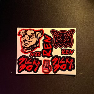 May include: A set of five stickers featuring a pig, a skull with crossbones, a boxing glove, and two logos that say "Sick Soy" in red and black lettering. The stickers are on a white background.