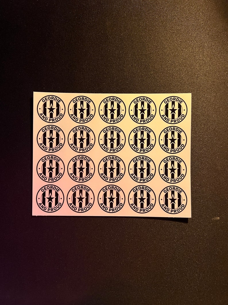 May include: A sheet of 15 black and white stickers with the text "Geordie and Proud" and a star and striped design.