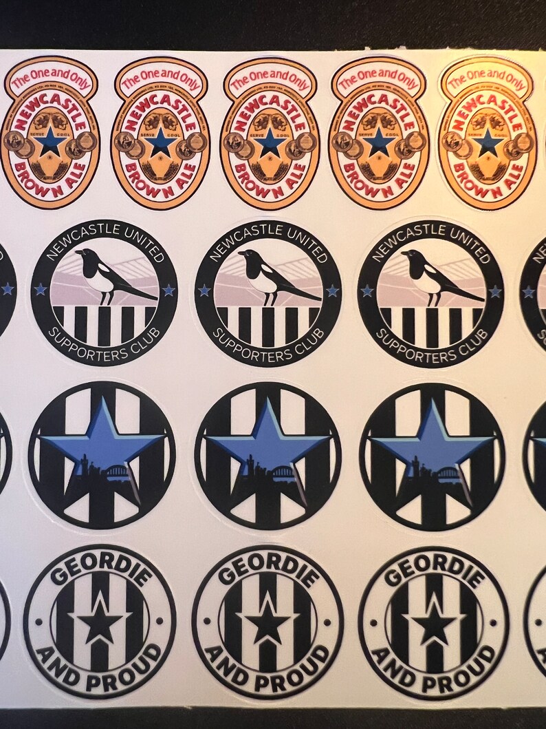 May include: A set of 10 round stickers featuring Newcastle United Football Club logos. The stickers feature the team's colors of black and white, with a magpie bird, a star, and the words "Newcastle United Supporters Club". There are also stickers with the words "The One and Only Newcastle Brown Ale" and "Geordie and Proud".