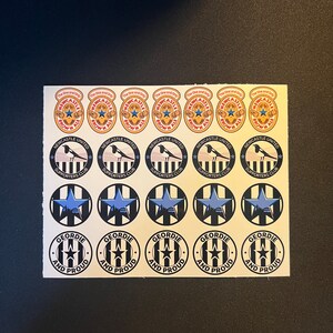 May include: A sheet of stickers featuring Newcastle United Football Club logos. The stickers feature the team's colors of black and white, with a blue star and the text "Newcastle United Supporters Club". Other stickers feature the text "The One and Only" and "Geordie and Proud".