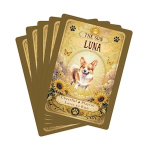 May include: A fan of rectangular cards with a gold border. The top card features a Corgi illustration, the text THE SUN LUNA, and the words Cheerful, Playful, Loves to Run. The design includes sunflowers, butterflies, and paw print icons.