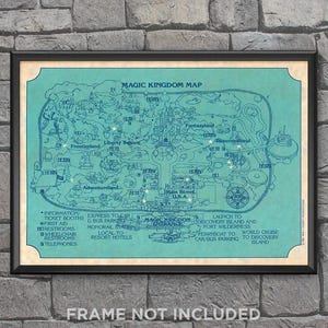 May include: A framed vintage-style map of Magic Kingdom, featuring a teal and cream color scheme. The map details various lands like Frontierland and Tomorrowland, with text labels and icons. The phrase "FRAME NOT INCLUDED" is at the bottom.