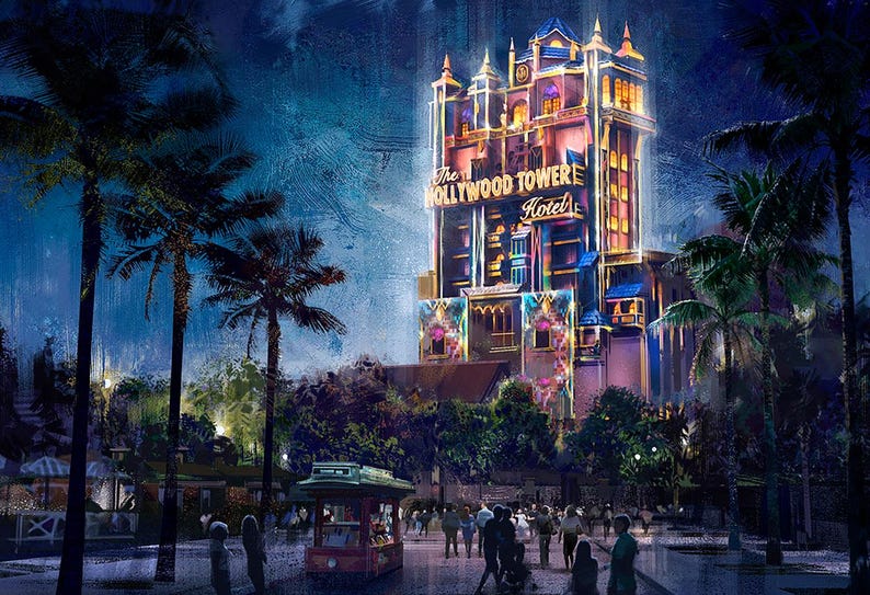 May include: A nighttime view of the Hollywood Tower Hotel, a tall, colorful building with a sign that reads "The Hollywood Tower Hotel". The building is lit up with lights and there are palm trees in the foreground.