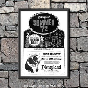 May include: Black and white framed vintage Disneyland Summer '72 poster. The poster features text for the Main Street Electrical Parade and Bear Country Country Bear Jamboree. The poster is displayed against a stone wall.