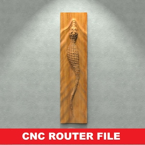 May include: A CNC router file for a wooden wall decor featuring a detailed carving of an alligator. The alligator is carved in a realistic style with scales and a textured surface.