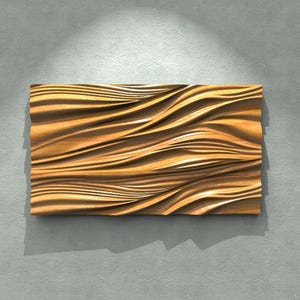May include: A rectangular wooden wall art piece with a wave-like pattern. The artwork is made of light brown wood and has a textured surface. The piece is mounted on a gray wall.
