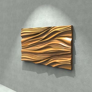 May include: A rectangular wooden wall art piece with a flowing, wave-like design. The artwork is made of light brown wood and is mounted on a gray wall. The piece is approximately 30 inches wide and 20 inches tall.