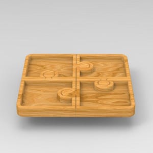 Puede incluir: Una bandeja de madera dividida en cuatro secciones, cada una con un dise&ntilde;o de corte &uacute;nico. La bandeja est&aacute; hecha de madera marr&oacute;n claro y tiene un acabado liso.