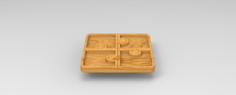Puede incluir: Una bandeja de madera dividida en cuatro secciones, cada una con un dise&ntilde;o de corte &uacute;nico. La bandeja est&aacute; hecha de madera marr&oacute;n claro y tiene un acabado liso.
