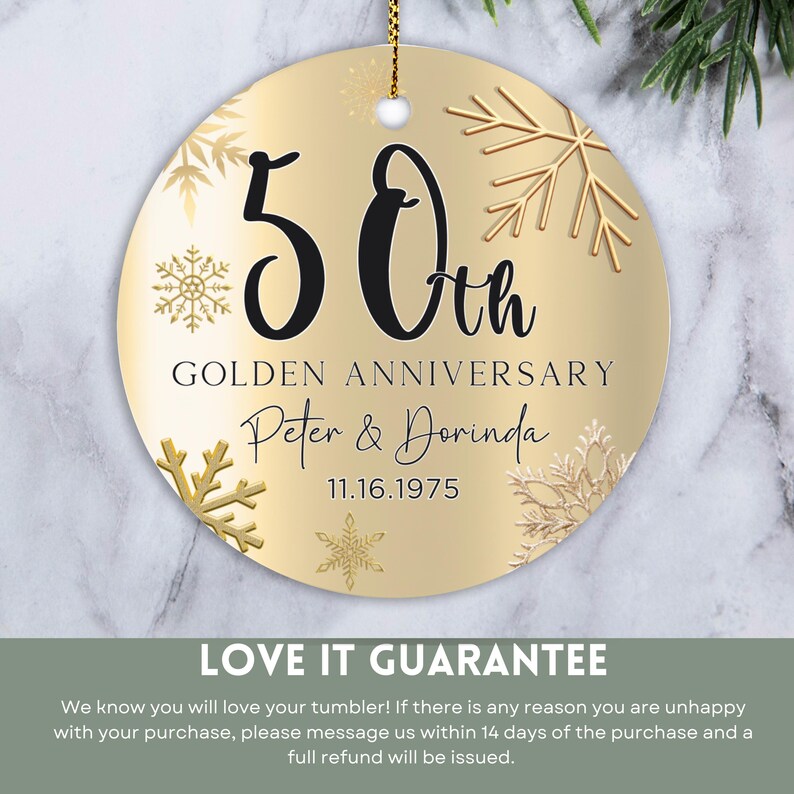 May include: Gold round ornament with a gold snowflake design and the text "50th Golden Anniversary Peter & Dorinda 11.16.1975".