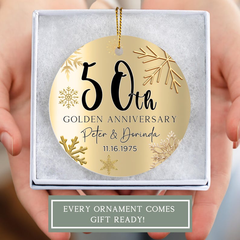 May include: Gold round ornament with a snowflake design. It says "50th Golden Anniversary Peter & Dorinda 11.16.1975"