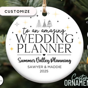 May include: White ceramic ornament with text "to an amazing WEDDING PLANNER" and "Summer Valley Planning". Includes text "SAWYER & MADDIE 2025". Features a customizable design with stars and tree illustrations. Includes the text "Custom ORNAMENTS".