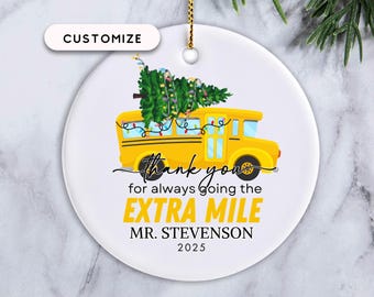May include: White ceramic Christmas ornament featuring a yellow school bus with a Christmas tree on top. The ornament has the text "thank you for always going the EXTRA MILE MR. STEVENSON 2025" and a gold string for hanging. The word "CUSTOMIZE" is at the top.