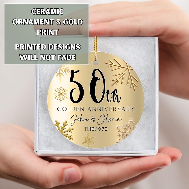May include: Gold ceramic ornament with a gold snowflake design and the text "50th Golden Anniversary John & Gloria 11.16.1975"