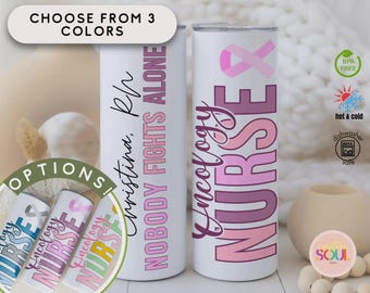 May include: White stainless steel tumbler with the words "Oncology Nurse" in pink and purple. The tumbler also has a pink ribbon design. The text "NOBODY FIGHTS ALONE" is printed vertically. The image shows three color options.