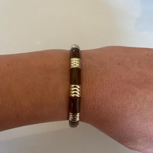 Elegant ladies bracelet bangle enamel look brown/gold colored with snap closure