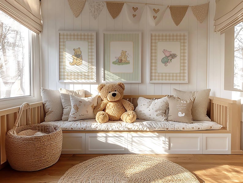 May include: A nursery interior with a wooden bench, cushions, and a teddy bear. Three framed Winnie the Pooh prints are displayed above. A woven basket and a circular rug contribute to the room's inviting feel. The colour scheme is soft and neutral.