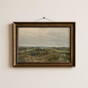 May include: A landscape painting in a dark gold ornate frame featuring a river valley with green vegetation under a cloudy sky. The text reads: Come to me, all who labor and are heavy laden, and I will give you rest. Matthew 11:28.