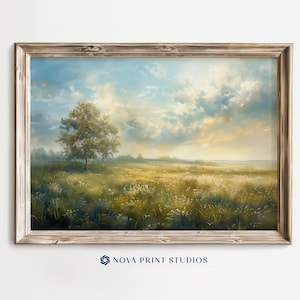 Puede incluir: Una pintura enmarcada de un paisaje con un solo árbol en primer plano. El cielo es de un azul claro con nubes blancas. El campo es verde y amarillo con flores silvestres.