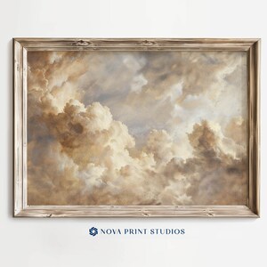 May include: A framed painting of a cloudy sky in shades of brown, beige, and white. The clouds are fluffy and appear to be moving across the sky. The frame is a simple, rustic wood frame.
