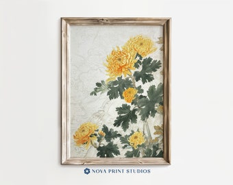 May include: A framed print of a watercolour painting featuring yellow chrysanthemums with green leaves on a white background. The frame is a light wood colour.