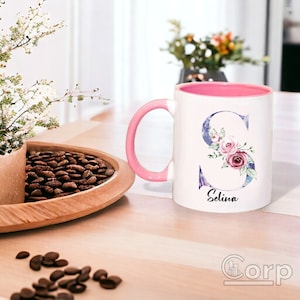 White ceramic mug with floral pattern and custom name inscription, ideal for gifting on occasions like Mother's Day or birthdays