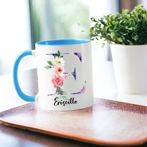 White ceramic mug with floral pattern and custom name inscription, ideal for gifting on occasions like Mother's Day or birthdays