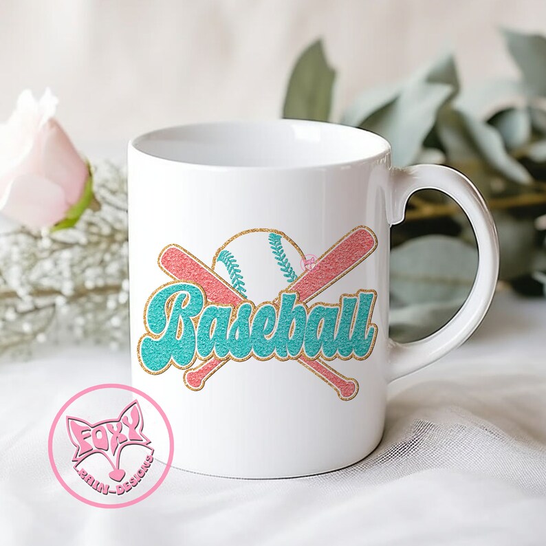 May include: White ceramic coffee mug with a teal and pink baseball graphic and the word "Baseball" in a teal and gold font.