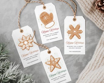 May include: Four white gift tags with festive gingerbread designs, including a mitten, snowflake, and star. Each tag has the text "Happy Holidays" and "Wishing you a sweet holiday season." The tags are tied with twine.