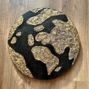 Handmade Textured Art Painting made with texture paste, gold and black acrylic paint, on a stretched round canvas. Diameter is 40 cm.