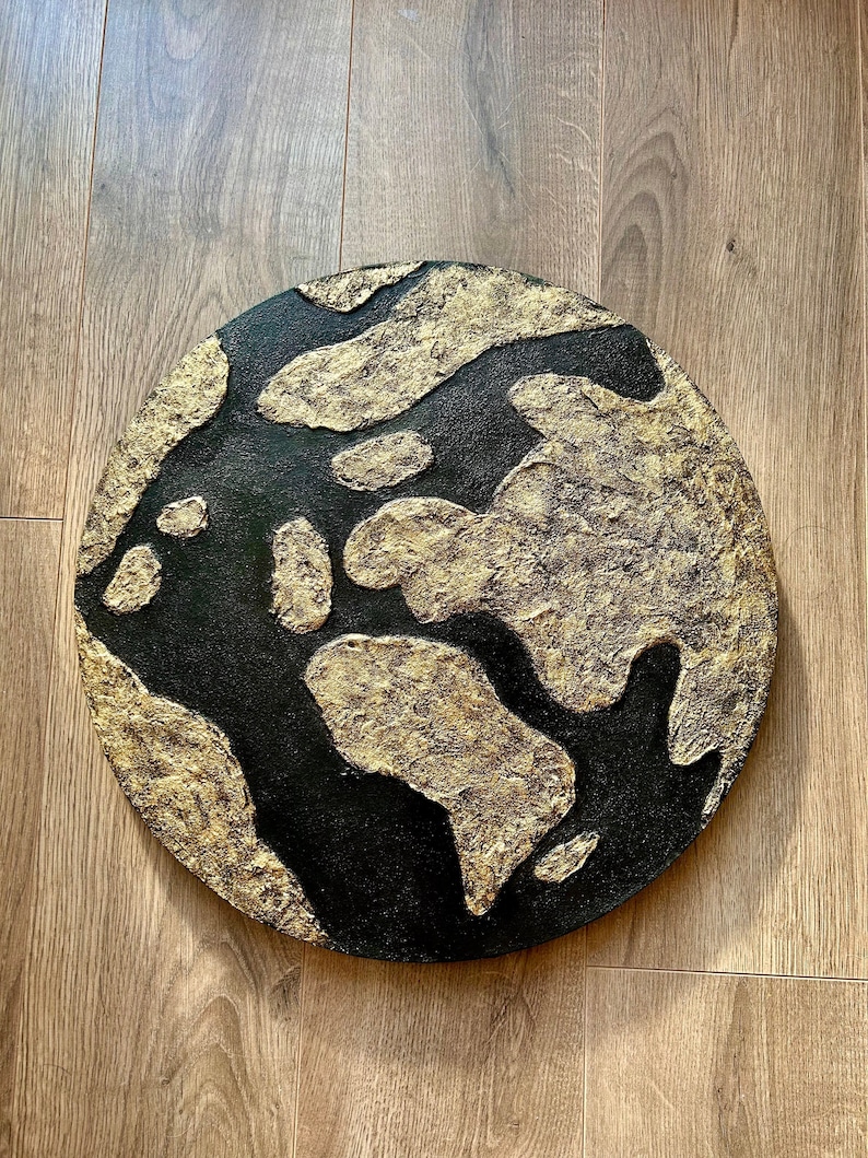 Handmade Textured Art Painting made with texture paste, gold and black acrylic paint, on a stretched round canvas. Diameter is 40 cm.