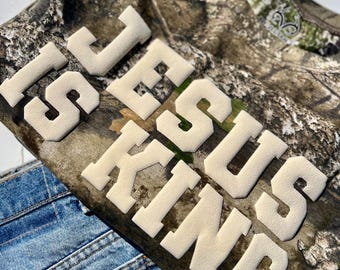 Custom Jesus Is King Realtree Puff Vinyl T-Shirt | Short Sleeve Camo Tee