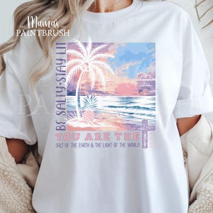 This “Be Salty, Stay Lit” Christian PNG design inspired by Matthew 5:13–16 features a peaceful tropical sunset, palm trees, ocean waves, and a cross—symbolizing faith, light, and God’s calling for believers to shine in the world. With its soft pastel coastal colors and uplifting Bible verse message, this digital download is perfect for creating faith-based apparel, gifts, and home décor.