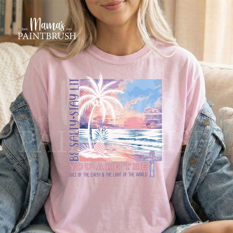 This “Be Salty, Stay Lit” Christian PNG design inspired by Matthew 5:13–16 features a peaceful tropical sunset, palm trees, ocean waves, and a cross—symbolizing faith, light, and God’s calling for believers to shine in the world. With its soft pastel coastal colors and uplifting Bible verse message, this digital download is perfect for creating faith-based apparel, gifts, and home décor.