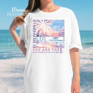 This “Be Salty, Stay Lit” Christian PNG design inspired by Matthew 5:13–16 features a peaceful tropical sunset, palm trees, ocean waves, and a cross—symbolizing faith, light, and God’s calling for believers to shine in the world. With its soft pastel coastal colors and uplifting Bible verse message, this digital download is perfect for creating faith-based apparel, gifts, and home décor.