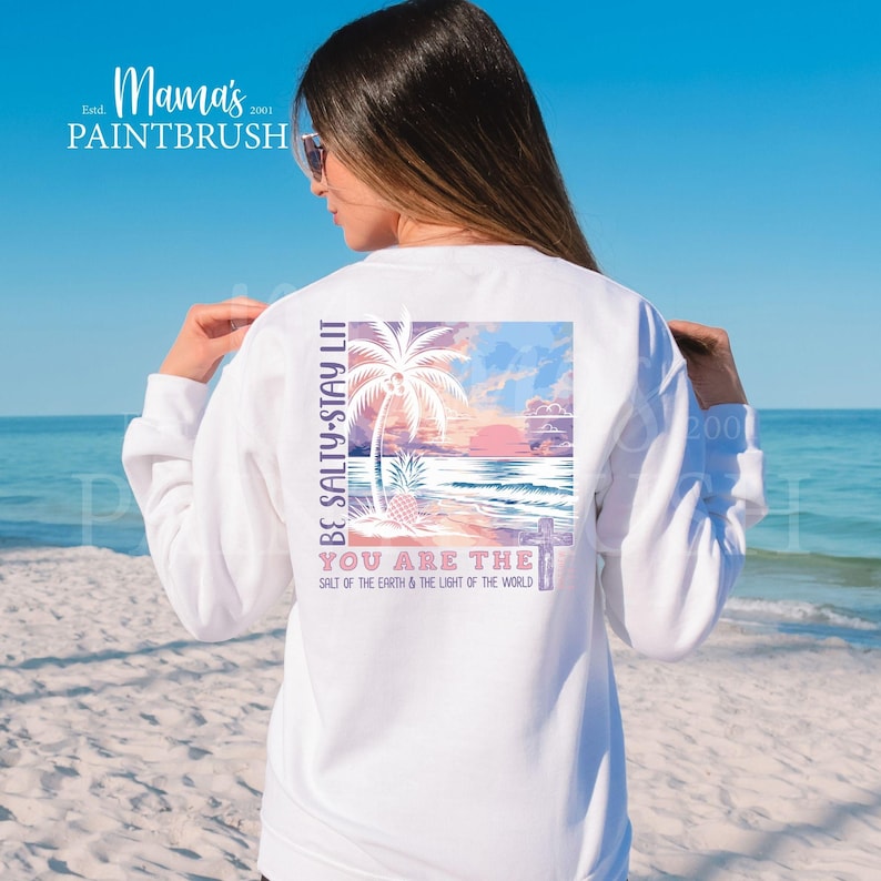 This “Be Salty, Stay Lit” Christian PNG design inspired by Matthew 5:13–16 features a peaceful tropical sunset, palm trees, ocean waves, and a cross—symbolizing faith, light, and God’s calling for believers to shine in the world. With its soft pastel coastal colors and uplifting Bible verse message, this digital download is perfect for creating faith-based apparel, gifts, and home décor.