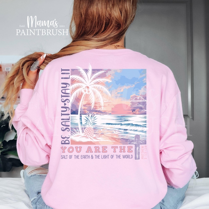 This “Be Salty, Stay Lit” Christian PNG design inspired by Matthew 5:13–16 features a peaceful tropical sunset, palm trees, ocean waves, and a cross—symbolizing faith, light, and God’s calling for believers to shine in the world. With its soft pastel coastal colors and uplifting Bible verse message, this digital download is perfect for creating faith-based apparel, gifts, and home décor.