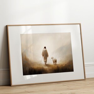 May include: A framed painting of a person in a white robe walking with a white lamb in a misty landscape.