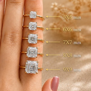 May include: Five gold rings with square-cut clear stones arranged by size. The stones are labelled with dimensions: 5x5 mm, 6x6 mm, 7x7 mm, 8x8 mm, and 9x9 mm. Each ring features a thin gold band and a single, faceted, square-shaped centre stone.
