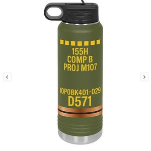 May include: Olive green water bottle with a black lid and handle. The bottle features yellow and white text: "155H COMP B PROJ M107" and "IOP08K401-029 D571". The bottom of the bottle is silver.