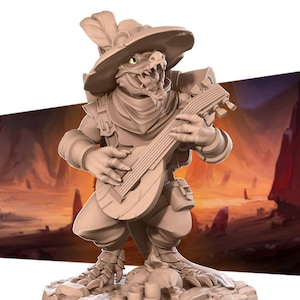May include: A beige, hand-painted miniature figurine of a lizard-like creature wearing a feathered hat and playing a lute. The creature has a toothy grin and is wearing a brown scarf and a belt with pouches. The figurine is standing on a small, rocky base.